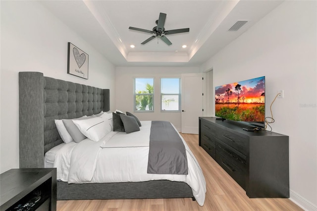 17333 Savory Mist Cir, Bradenton, FL 34211 - bedroom featuring light wood-type flooring, crown molding, recessed lighting, a raised ceiling, and ceiling fan