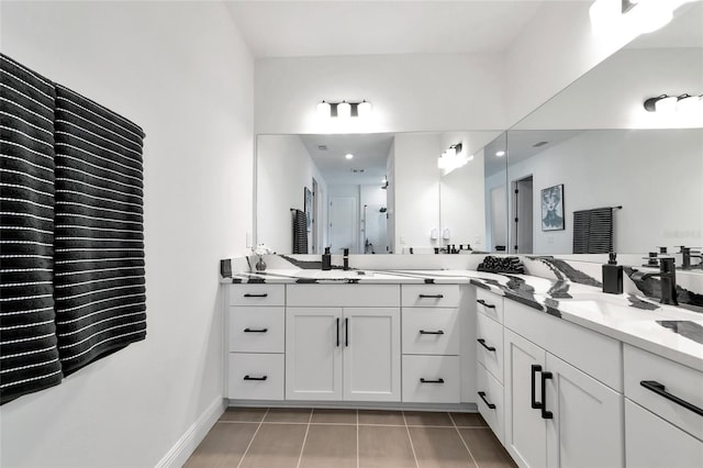 17333 Savory Mist Cir, Bradenton, FL 34211 - bathroom with tile patterned floors, double vanity, a stall shower, and baseboards