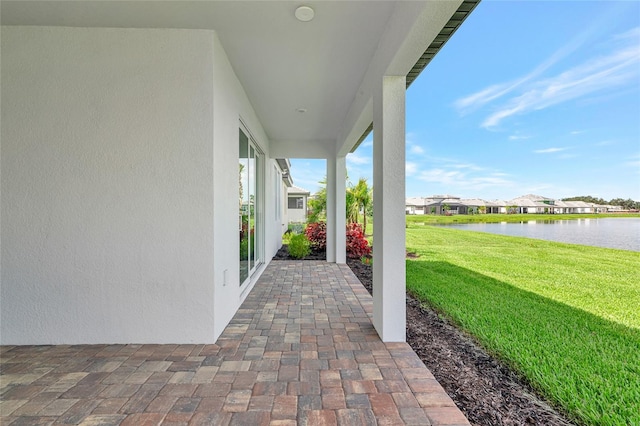 17333 Savory Mist Cir, Bradenton, FL 34211 - view of patio featuring a water view and a residential view