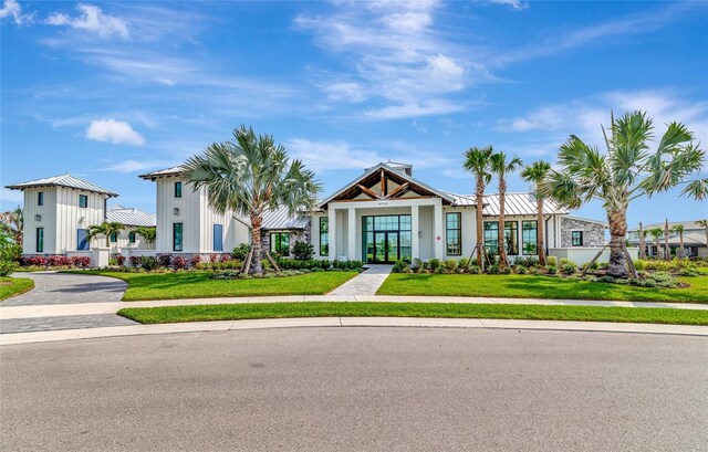 17333 Savory Mist Cir, Bradenton, FL 34211 - view of front of home featuring a front yard and french doors
