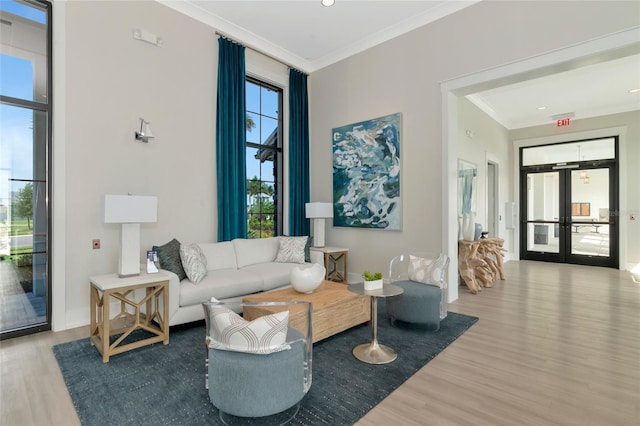 17333 Savory Mist Cir, Bradenton, FL 34211 - living area with wood finished floors, french doors, ornamental molding, and baseboards