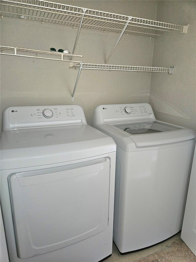 5146 Northridge Rd Unit 310, Sarasota, FL 34238 - laundry area with washing machine and dryer