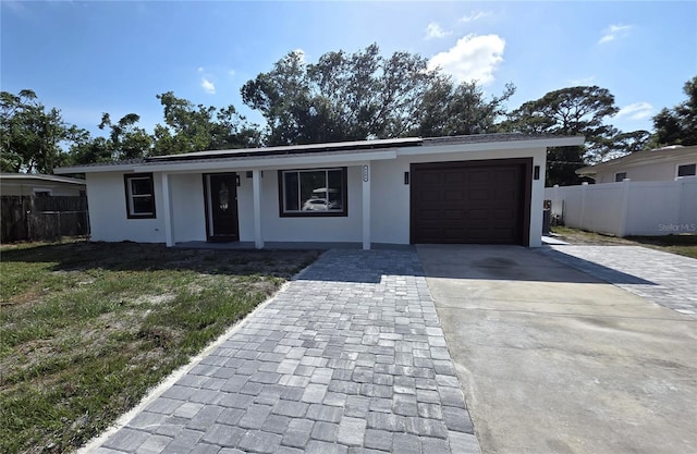 6404 8th Street Ct W, Bradenton, FL 34207 - ranch-style house with driveway, stucco siding, a garage, and covered porch