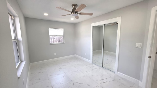 6404 8th Street Ct W, Bradenton, FL 34207 - unfurnished bedroom with light marble finish flooring, baseboards, recessed lighting, a closet, and ceiling fan