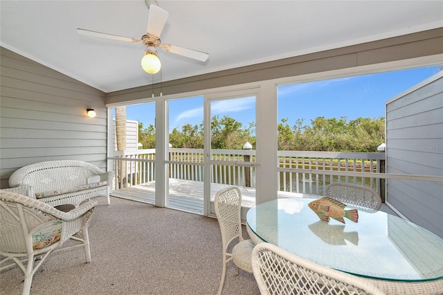 1316 Perico Point Cir, Bradenton, FL 34209 - sunroom featuring a ceiling fan, a water view, lofted ceiling, and outdoor dining area