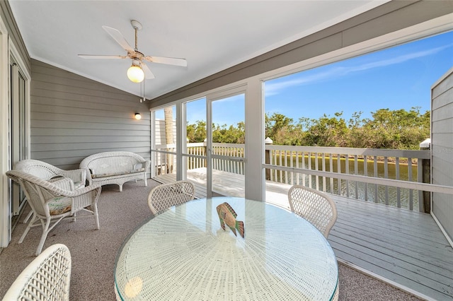 1316 Perico Point Cir, Bradenton, FL 34209 - sunroom / solarium featuring ceiling fan, lofted ceiling, a water view, and outdoor dining area