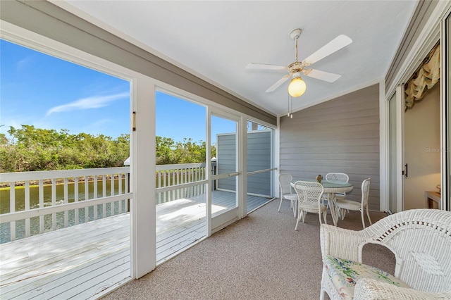 1316 Perico Point Cir, Bradenton, FL 34209 - sunroom with vaulted ceiling, a ceiling fan, and outdoor dining area