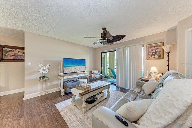 4057 Crockers Lake Blvd Unit 15, Sarasota, FL 34238 - living area featuring wood finished floors, a ceiling fan, and a textured ceiling