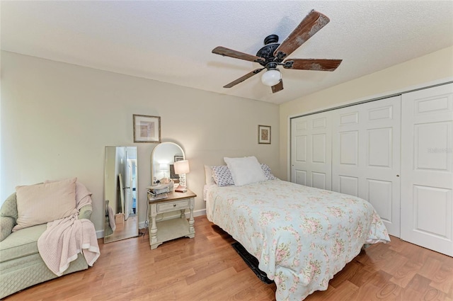 4057 Crockers Lake Blvd Unit 15, Sarasota, FL 34238 - bedroom featuring a closet, light wood-style flooring, and a ceiling fan