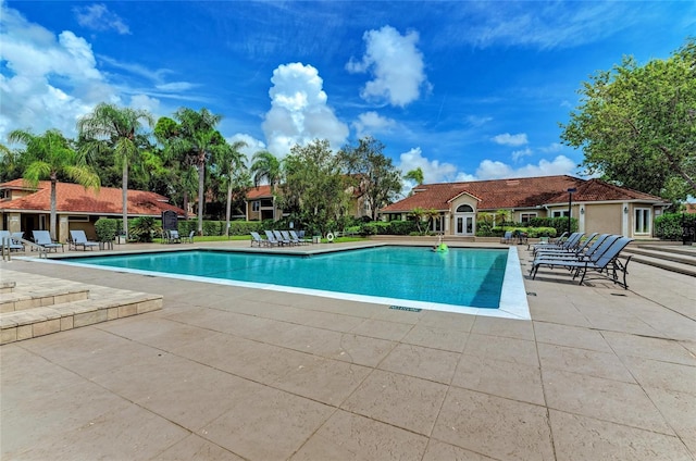 4057 Crockers Lake Blvd Unit 15, Sarasota, FL 34238 - community pool featuring a patio area
