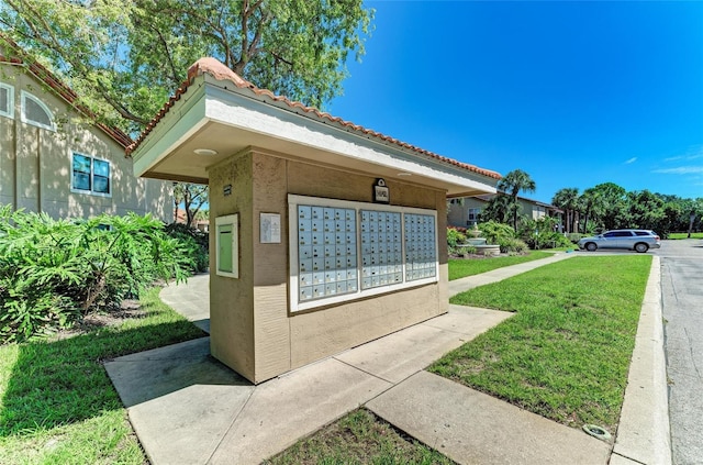 4057 Crockers Lake Blvd Unit 15, Sarasota, FL 34238 - view of home's community featuring mail area and a lawn