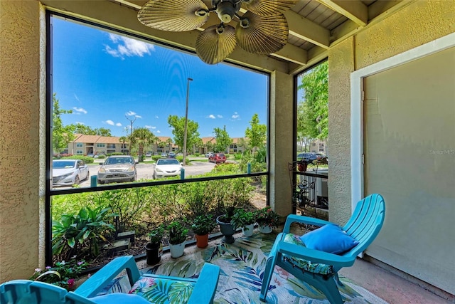 4057 Crockers Lake Blvd Unit 15, Sarasota, FL 34238 - sunroom featuring ceiling fan and a residential view