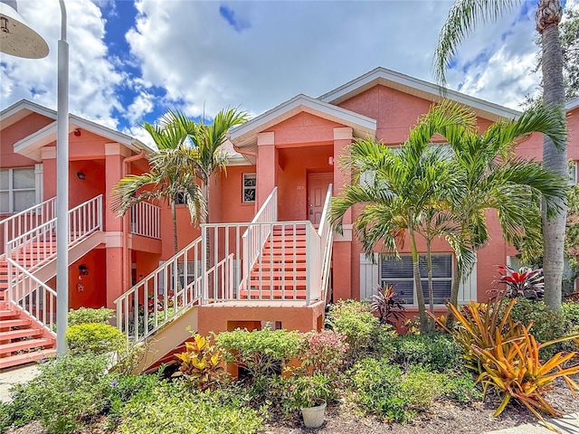 5500 Longwood Run Blvd Unit 203, Sarasota, FL 34243 - view of front facade with stairs and stucco siding