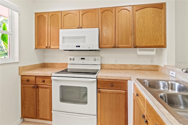 5500 Longwood Run Blvd Unit 203, Sarasota, FL 34243 - kitchen with white appliances and light countertops