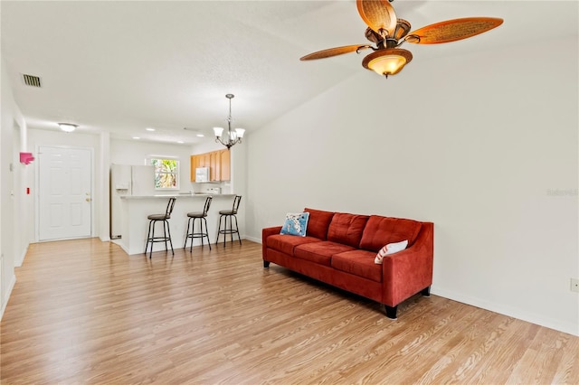5500 Longwood Run Blvd Unit 203, Sarasota, FL 34243 - living area with light wood-style flooring, a chandelier, and a ceiling fan