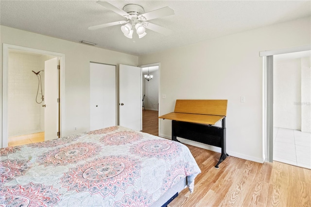5500 Longwood Run Blvd Unit 203, Sarasota, FL 34243 - bedroom with wood finished floors, ensuite bath, and ceiling fan
