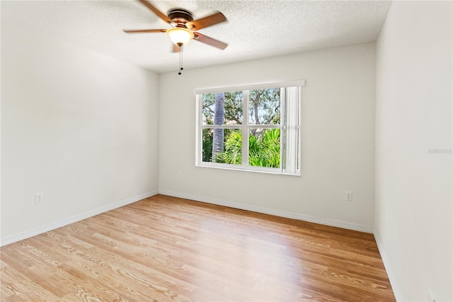 5500 Longwood Run Blvd Unit 203, Sarasota, FL 34243 - spare room with light wood-type flooring, ceiling fan, and a textured ceiling