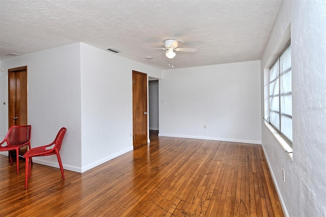 1354 22nd St, Sarasota, FL 34234 - unfurnished room with ceiling fan, hardwood / wood-style flooring, and a textured ceiling