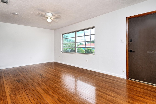 1354 22nd St, Sarasota, FL 34234 - empty room featuring a ceiling fan, hardwood / wood-style flooring, and a textured ceiling