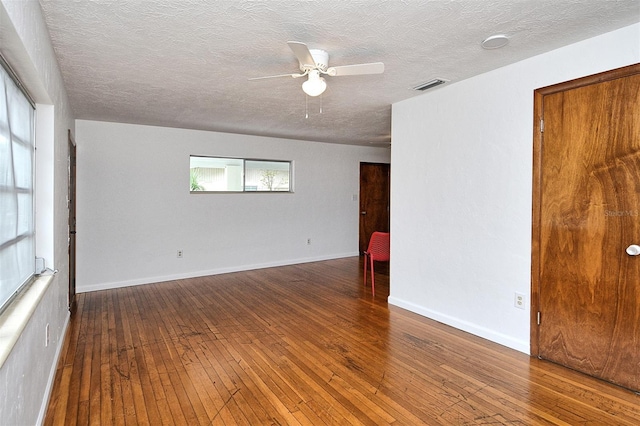 1354 22nd St, Sarasota, FL 34234 - unfurnished room with hardwood / wood-style floors, a ceiling fan, and a textured ceiling
