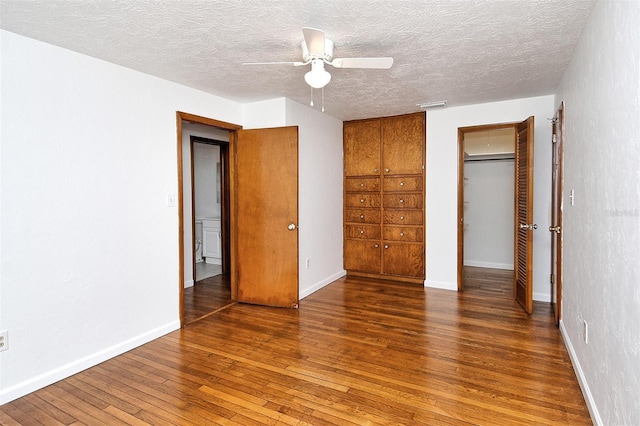 1354 22nd St, Sarasota, FL 34234 - unfurnished bedroom with hardwood / wood-style flooring, a textured ceiling, a closet, and ceiling fan