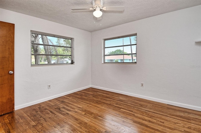1354 22nd St, Sarasota, FL 34234 - spare room with hardwood / wood-style flooring, plenty of natural light, a textured ceiling, and ceiling fan