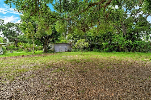 1354 22nd St, Sarasota, FL 34234 - view of yard with a detached garage
