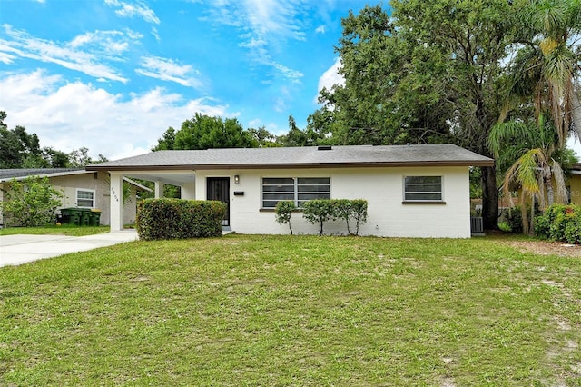 1354 22nd St, Sarasota, FL 34234 - ranch-style house with a front yard, concrete driveway, and an attached carport