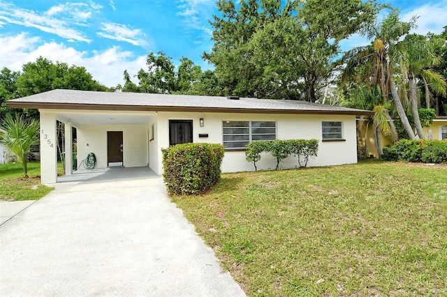 1354 22nd St, Sarasota, FL 34234 - single story home with driveway, a front lawn, and a carport