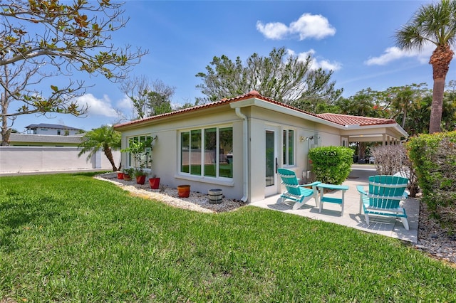 139 Vista Hermosa Cir, Sarasota, FL 34242 - rear view of property with stucco siding, a tile roof, and a patio area