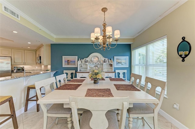 7820 34th Ave W Unit 102, Bradenton, FL 34209 - dining room featuring crown molding, a chandelier, light tile patterned flooring, recessed lighting, and a textured ceiling