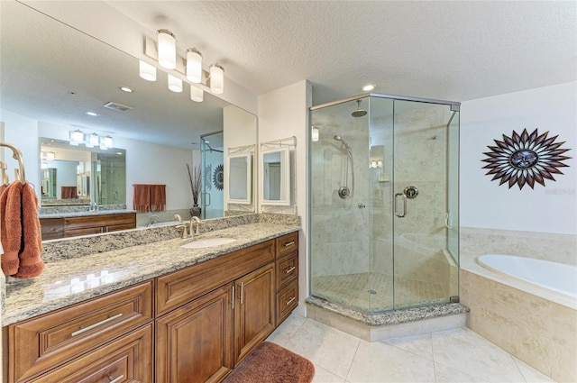 7820 34th Ave W Unit 102, Bradenton, FL 34209 - full bath with a garden tub, tile patterned flooring, a stall shower, vanity, and recessed lighting