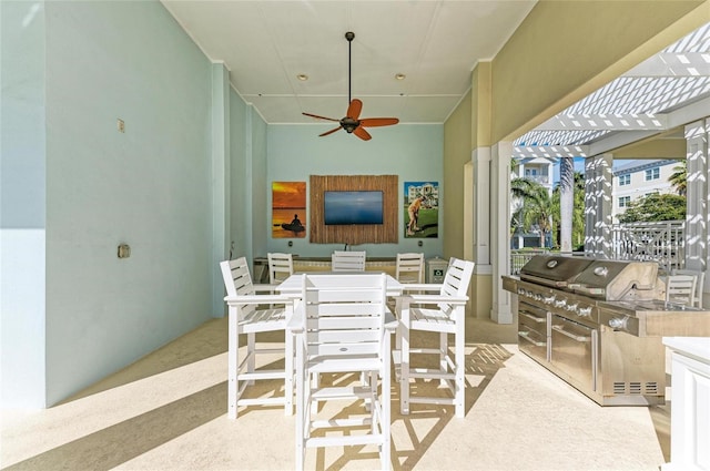 7820 34th Ave W Unit 102, Bradenton, FL 34209 - view of patio / terrace with a pergola, ceiling fan, an outdoor kitchen, and outdoor dining space