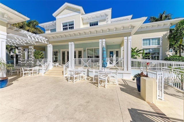 7820 34th Ave W Unit 102, Bradenton, FL 34209 - porch featuring a pergola, a patio, and french doors
