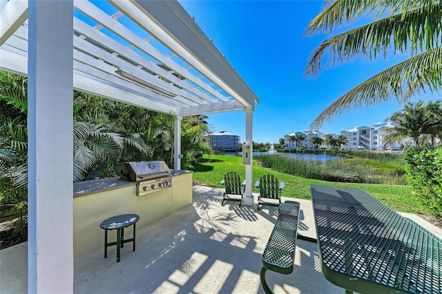 7820 34th Ave W Unit 102, Bradenton, FL 34209 - view of patio / terrace with a pergola, area for grilling, and a water view
