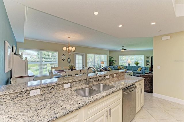 7820 34th Ave W Unit 102, Bradenton, FL 34209 - kitchen with stainless steel dishwasher, healthy amount of natural light, light stone counters, and recessed lighting