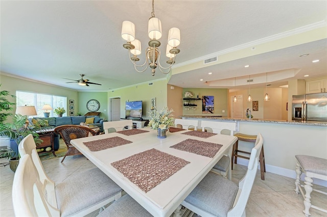 7820 34th Ave W Unit 102, Bradenton, FL 34209 - dining area featuring crown molding, light tile patterned flooring, a ceiling fan, recessed lighting, and a chandelier