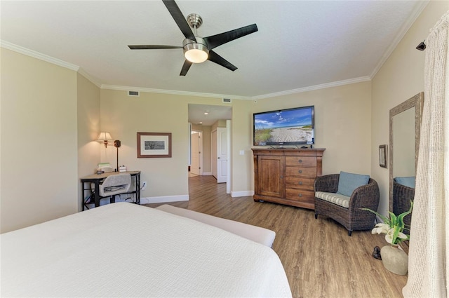 7820 34th Ave W Unit 102, Bradenton, FL 34209 - bedroom with wood finished floors, crown molding, and ceiling fan