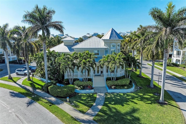 7820 34th Ave W Unit 102, Bradenton, FL 34209 - coastal inspired home with a metal roof, a front yard, and a standing seam roof
