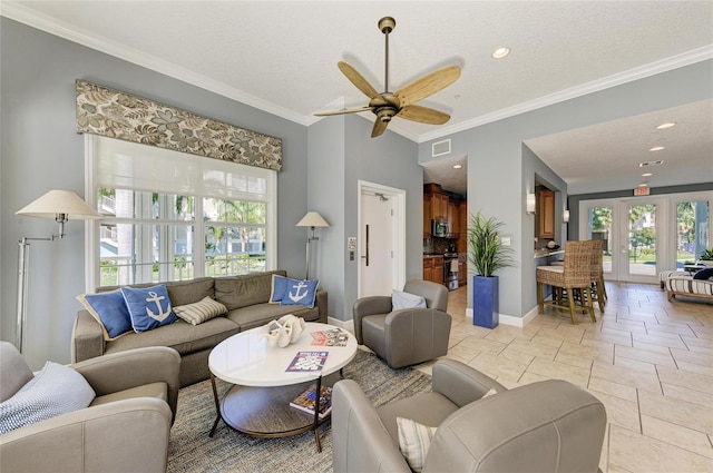7820 34th Ave W Unit 102, Bradenton, FL 34209 - living area featuring plenty of natural light, a ceiling fan, ornamental molding, french doors, and stone tile floors
