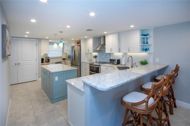 5750 Midnight Pass Rd Unit 203, Sarasota, FL 34242 - kitchen featuring stainless steel appliances, wall chimney range hood, a peninsula, light stone countertops, and a breakfast bar