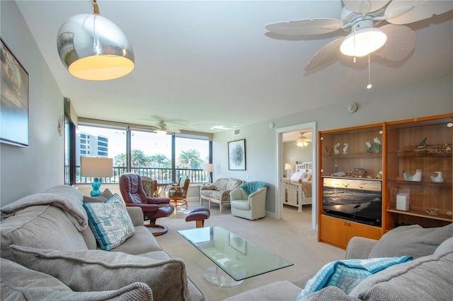 5750 Midnight Pass Rd Unit 203, Sarasota, FL 34242 - living area featuring a ceiling fan and light colored carpet