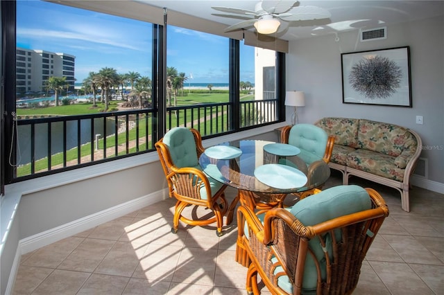 5750 Midnight Pass Rd Unit 203, Sarasota, FL 34242 - sunroom / solarium featuring tile patterned floors and baseboards