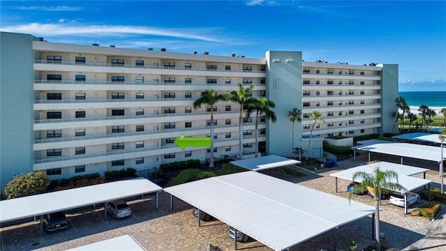 5750 Midnight Pass Rd Unit 203, Sarasota, FL 34242 - view of apartment building / complex featuring a water view