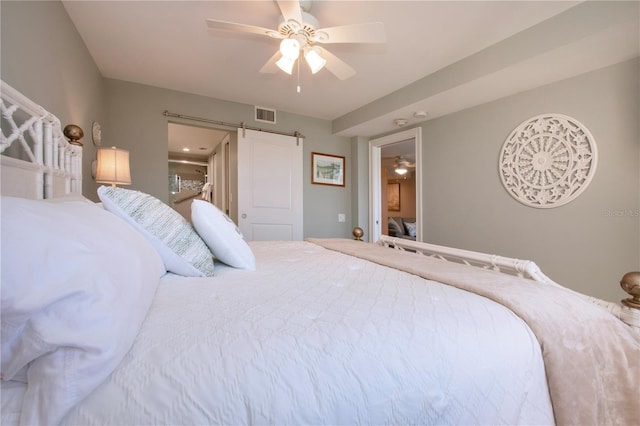 5750 Midnight Pass Rd Unit 203, Sarasota, FL 34242 - bedroom featuring ceiling fan and a barn door