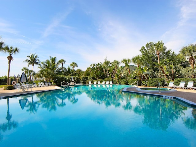 5880 Midnight Pass Rd Unit 202, Sarasota, FL 34242 - community pool featuring a hot tub and a patio