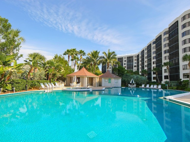 5880 Midnight Pass Rd Unit 202, Sarasota, FL 34242 - community pool featuring a gazebo and a patio area