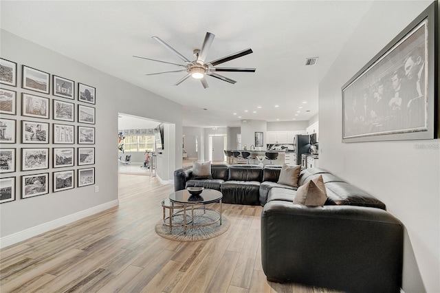 2912 51st St E, Bradenton, FL 34208 - living area featuring a ceiling fan, light wood finished floors, and recessed lighting