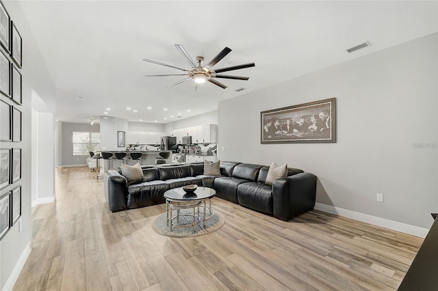2912 51st St E, Bradenton, FL 34208 - living room with ceiling fan, light wood finished floors, and recessed lighting