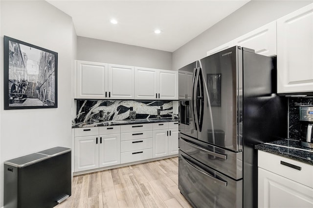 2912 51st St E, Bradenton, FL 34208 - kitchen with refrigerator with ice dispenser, backsplash, white cabinetry, recessed lighting, and light wood-style flooring